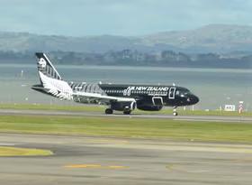 Air NZ All Black A320 landing in Auckland taken from the terminal departure lounge