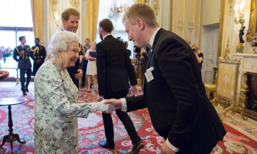 Photo of Brad with Her Majesty Queen Elizabeth II
