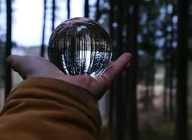 A person holding a crystal ball in their hand