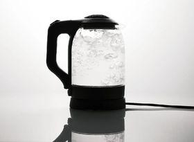 Electric glass kettle with water