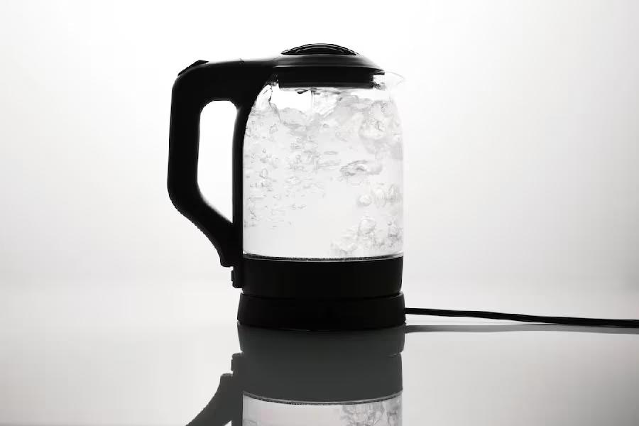 Electric glass kettle with water