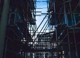 Scaffolding between buildings in city