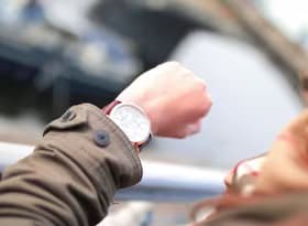 Selective Focus Photography of Person Watching Watch